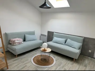 Coin salon dans l'établissement Maison de vacances au centre Biscarrosse