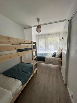 Un ou plusieurs lits dans un hébergement de l'établissement Appartement 4 personnes Mimizan