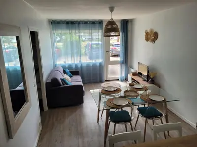 Coin salon dans l'établissement Appartement 4 personnes Mimizan
