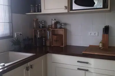 Cuisine ou kitchenette dans l'établissement Maison dans les Landes au bord de l'océan