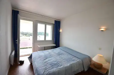 Un ou plusieurs lits dans un hébergement de l'établissement HOSSEGOR RAYON VERT - En front de mer superbe vue océan, plages, Pyrénées, estacade et pinède