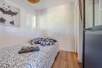 Un ou plusieurs lits dans un hébergement de l'établissement Appartement avec terrasse/Bord de mer/Idéal SURF