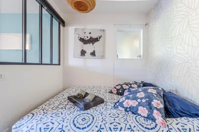 Un ou plusieurs lits dans un hébergement de l'établissement Appartement avec terrasse/Bord de mer/Idéal SURF