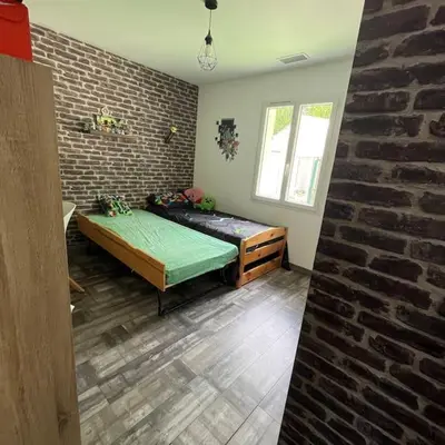 Un ou plusieurs lits dans un hébergement de l'établissement Maison 3 chambres avec piscine chauffée