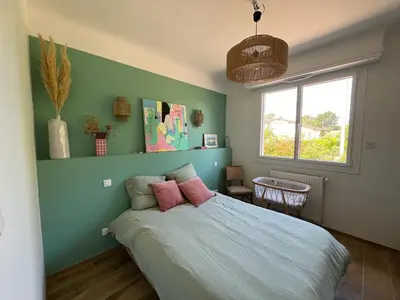 Un ou plusieurs lits dans un hébergement de l'établissement Maison avec piscine à SEIGNOSSE 8 personnes