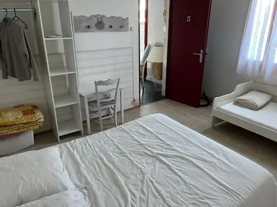 Un ou plusieurs lits dans un hébergement de l'établissement Charmante maison landaise