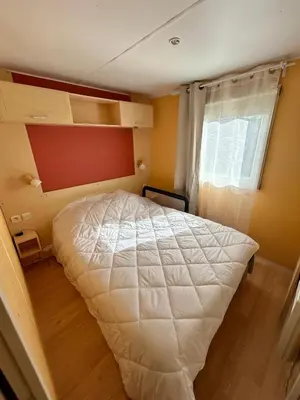 Un ou plusieurs lits dans un hébergement de l'établissement Mobil home camping Lalande Mimizan
