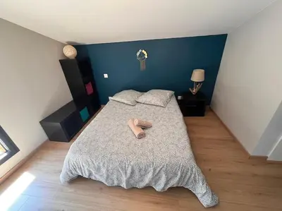 Un ou plusieurs lits dans un hébergement de l'établissement Villa calme
