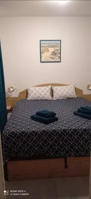 Un ou plusieurs lits dans un hébergement de l'établissement chalet T4 ondres piscine et tennis