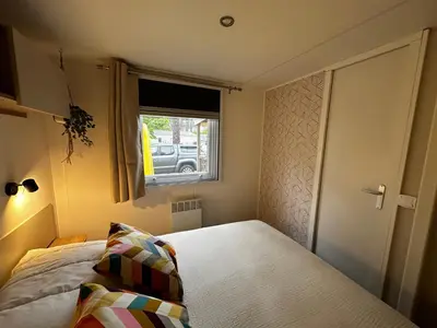 Un ou plusieurs lits dans un hébergement de l'établissement Grand Mobil Home Tout Confort pour 6 personnes - Camping Les Oyats 4 étoiles