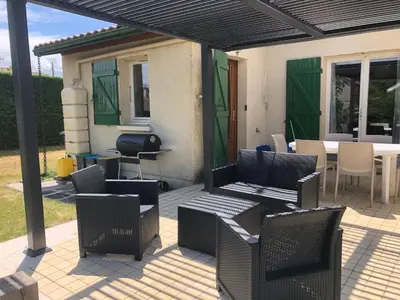 Coin salon dans l'établissement Maison de vacances à Cazaux