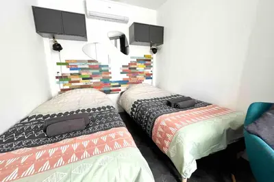 Un ou plusieurs lits dans un hébergement de l'établissement Cosy flat 2 steps from the port 4pers