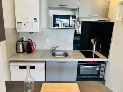 Cuisine ou kitchenette dans l'établissement Les Rives d'Acqs