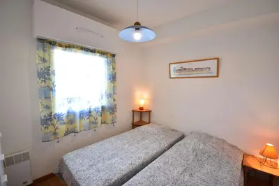 Un ou plusieurs lits dans un hébergement de l'établissement Résidence Les Terrasses de Notre Dame, bel appartement avec vue sur l'entrée du port