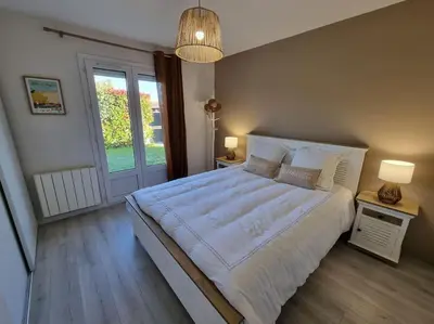 Un ou plusieurs lits dans un hébergement de l'établissement Belle Villa bassin d'Arcachon