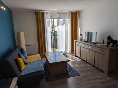 Télévision ou salle de divertissement dans l'établissement Le DÉLICE DES DUNES