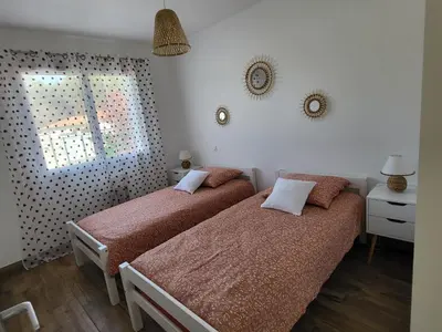 Un ou plusieurs lits dans un hébergement de l'établissement Maison au calme proche océan