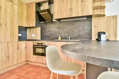 Cuisine ou kitchenette dans l'établissement Les Maisons du Domaine du Golf de Pinsolle - maeva Home - Maison 3 pièces 4 personnes - Exclusive - Super Home MAE-5961