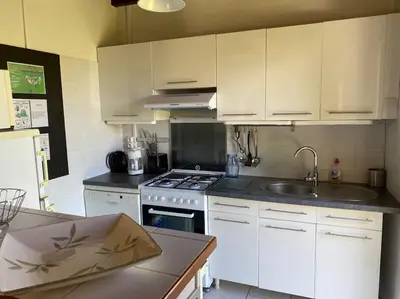 Cuisine ou kitchenette dans l'établissement Maison proche du sentier du littoral Gujan-Mestras