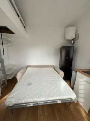 Un ou plusieurs lits dans un hébergement de l'établissement Studio avec piscine partagée