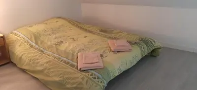 Un ou plusieurs lits dans un hébergement de l'établissement Appartement cosy 4 personnes