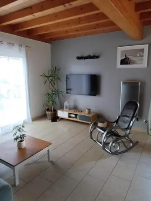 Télévision ou salle de divertissement dans l'établissement Maison au coeur de Capbreton