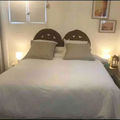 Un ou plusieurs lits dans un hébergement de l'établissement Belle appartement T2 avec jardin