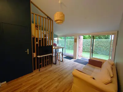 Coin salon dans l'établissement Logement Nature Plages Forêts