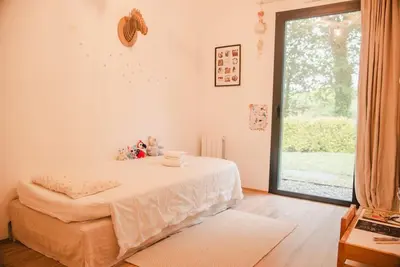 Un ou plusieurs lits dans un hébergement de l'établissement Villa Nature à 10 min des plages et d'Hossegor