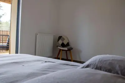 Un ou plusieurs lits dans un hébergement de l'établissement Le Cottage Des Glycines - Piscine chauffée