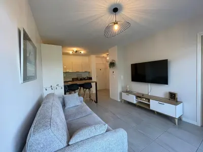 Télévision ou salle de divertissement dans l'établissement Charmant T2 proche plages et commerces avec terrasse à Vieux-Boucau - FR-1-239-1072