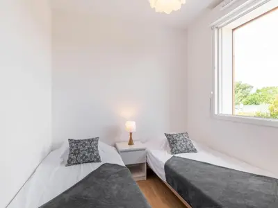 Un ou plusieurs lits dans un hébergement de l'établissement Apartment SC G01 by Interhome