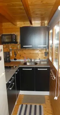 Cuisine ou kitchenette dans l'établissement Charmant chalet en bois