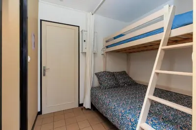 Un ou plusieurs lits dans un hébergement de l'établissement MimiZen - Vue sur locéan la plage de la Garluche