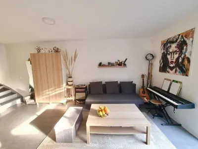 Coin salon dans l'établissement Maison de famille à 300m de la plage
