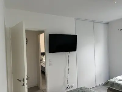 Télévision ou salle de divertissement dans l'établissement Appartement Biscarrosse