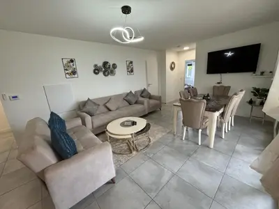 Télévision ou salle de divertissement dans l'établissement Appartement Biscarrosse
