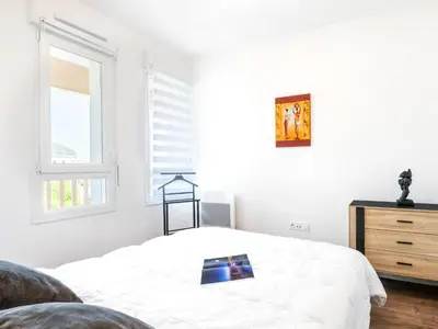 Un ou plusieurs lits dans un hébergement de l'établissement Apartment Jade et Elena-1 by Interhome