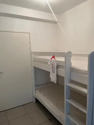 Un ou plusieurs lits dans un hébergement de l'établissement Appartement