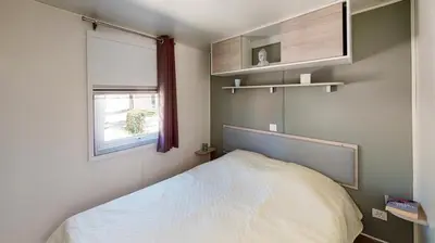 Un ou plusieurs lits dans un hébergement de l'établissement Mobil-home confort 6 personnes
