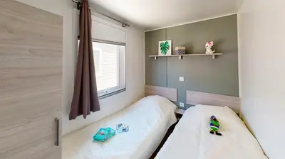 Un ou plusieurs lits dans un hébergement de l'établissement Mobil-home confort 6 personnes