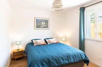 Un ou plusieurs lits dans un hébergement de l'établissement Appartement à 200 m de la plage