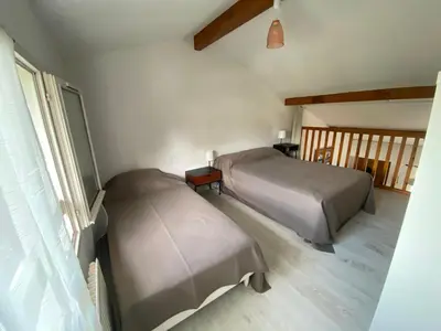Un ou plusieurs lits dans un hébergement de l'établissement Maison à 800m de la plage classée 1 étoile