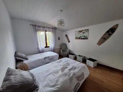 Un ou plusieurs lits dans un hébergement de l'établissement Maison à 20 min des plages Landaises