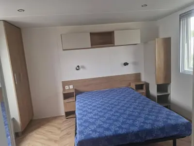 Un ou plusieurs lits dans un hébergement de l'établissement Mobil home contis lettes 40170