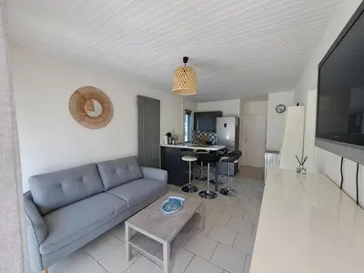 Télévision ou salle de divertissement dans l'établissement Cottage au cœur des Landes