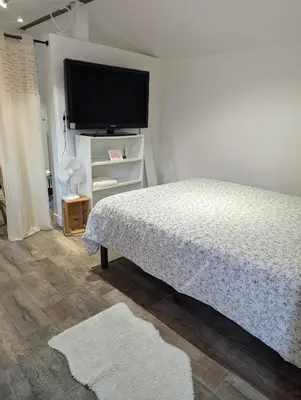 Un ou plusieurs lits dans un hébergement de l'établissement Chambre California