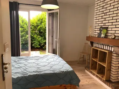 Un ou plusieurs lits dans un hébergement de l'établissement Chez Loulou chambre indépendante