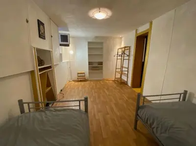 Un ou plusieurs lits dans un hébergement de l'établissement Vaste appartement, jardin, proximité océan