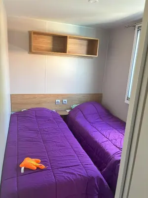 Un ou plusieurs lits dans un hébergement de l'établissement Mobilhome 8 personnes au bord de l'Océan